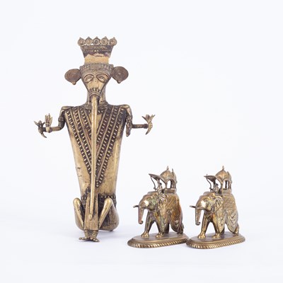 Lot 814 - An Indian brass tribal figure depicting the seated Ganesh