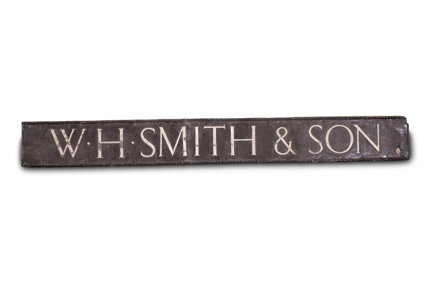 Lot 1 - A large brown painted lead store or shop sign for W. H. Smith & Son