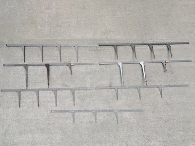 Lot 60 - Seven painted metal shelf fittings