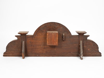 Lot 27 - An arched oak overdoor panel