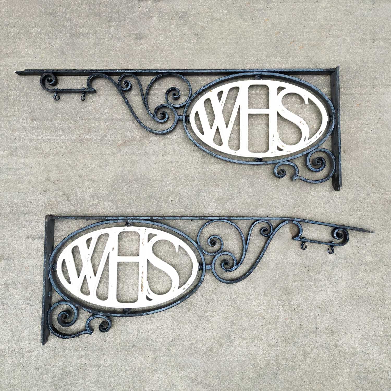 Lot 46 - A pair of large black painted wrought iron brackets
