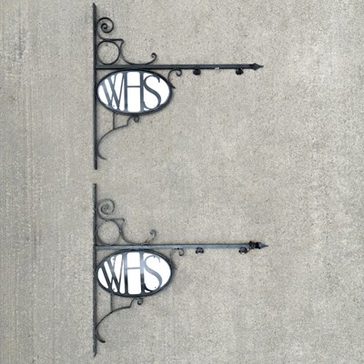 Lot 45 - A near pair of W. H. Smith wrought iron brackets