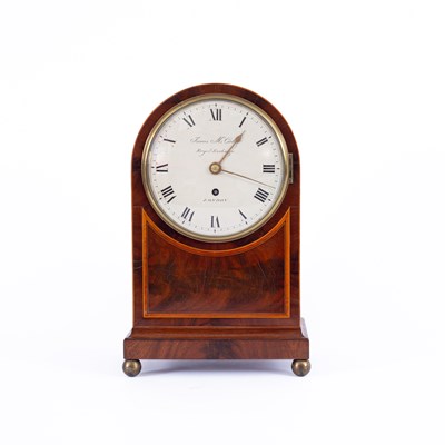 Lot 1014 - A mahogany mantel timepiece