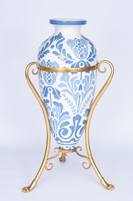 Lot 1201 - A cream glazed pottery vase