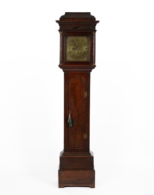 Lot 1010 - An oak longcase clock