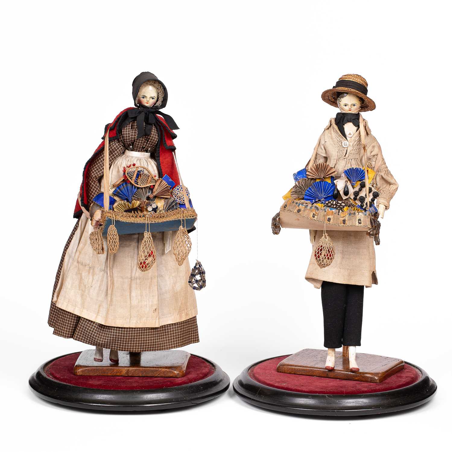Lot 635 - A fine pair of large Grodnertal pedlar dolls