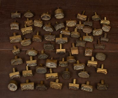 Lot 495 - A collection of early 20th Century brass sports shop stamps