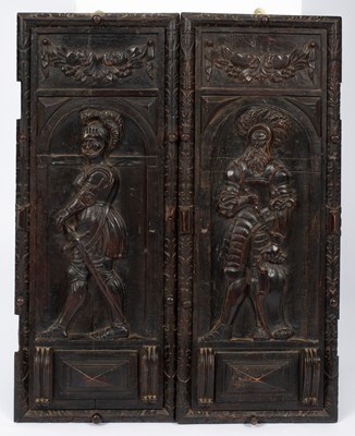 Lot 679 - A pair of Italian carved walnut cupboard doors