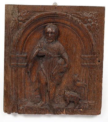 Lot 645 - A carved oak panel depicting John the Baptist