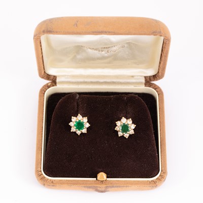 Lot 5 - A pair of emerald and diamond cluster earrings