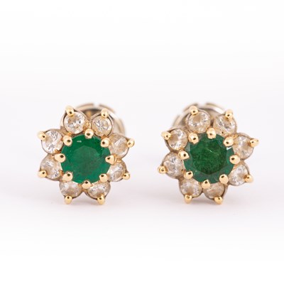 Lot 5 - A pair of emerald and diamond cluster earrings