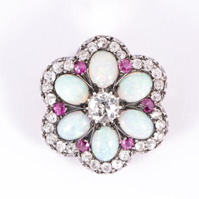 Lot 101 - An early 20th Century opal, diamond and ruby pendant brooch of flowerhead form