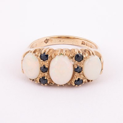 Lot 14 - A 9ct yellow gold opal and sapphire dress ring