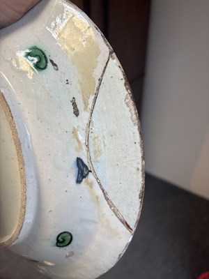 Lot 614 - An Iznik pottery dish