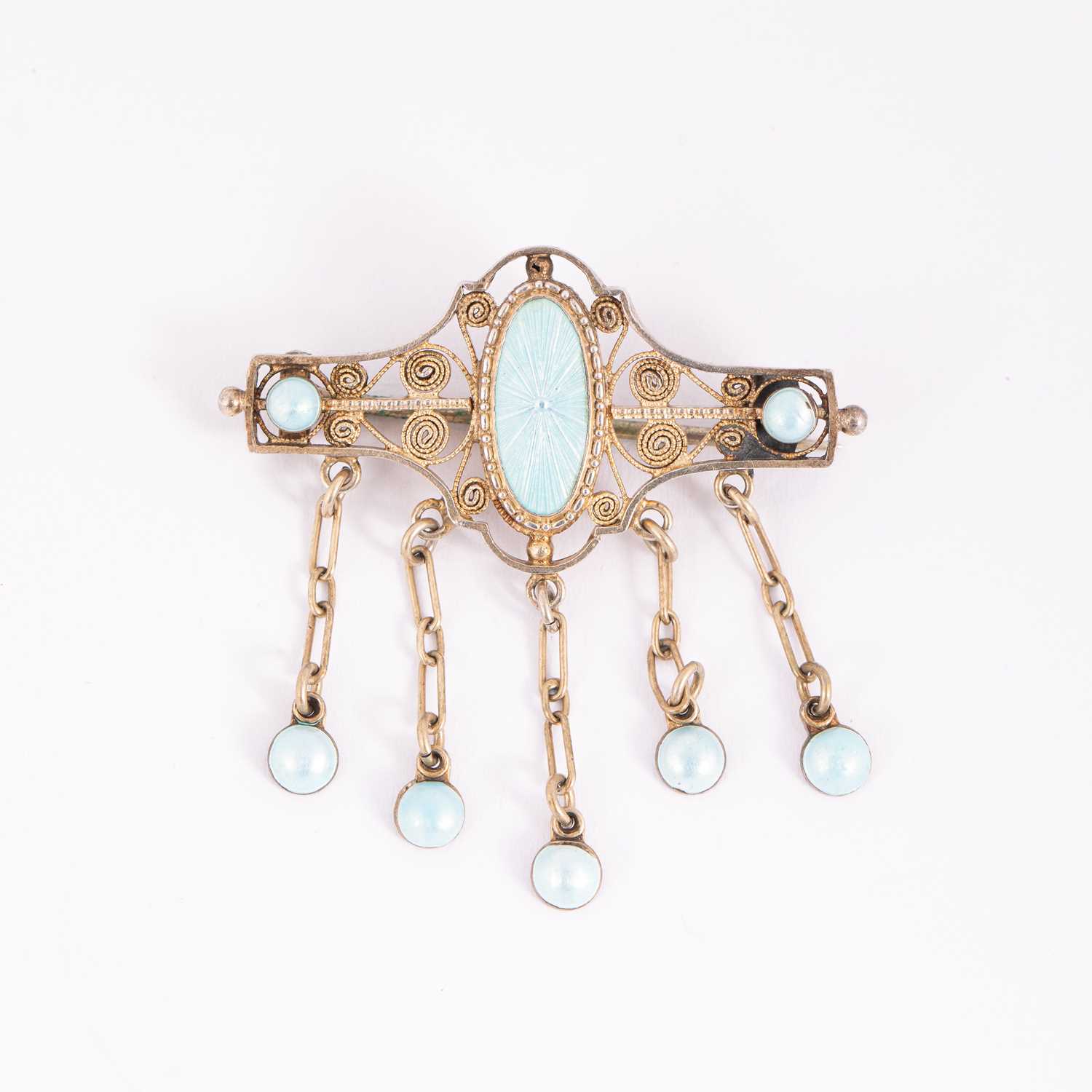 Lot 23 - A Norwegian Art Nouveau silver filigree and blue enamel brooch
