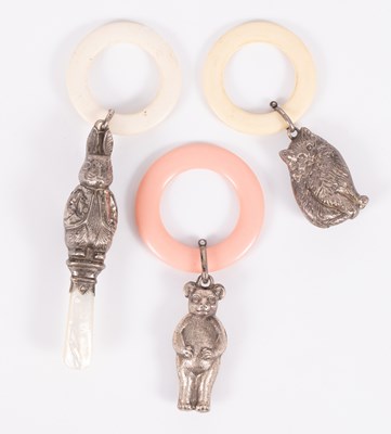 Lot 84 - Three novelty rattles with teething rings