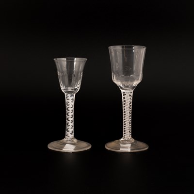 Lot 844 - Two English double series opaque twist wine glasses