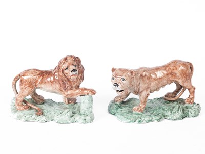 Lot 108 - A pair of 19th Century ceramic models of a lion and lioness