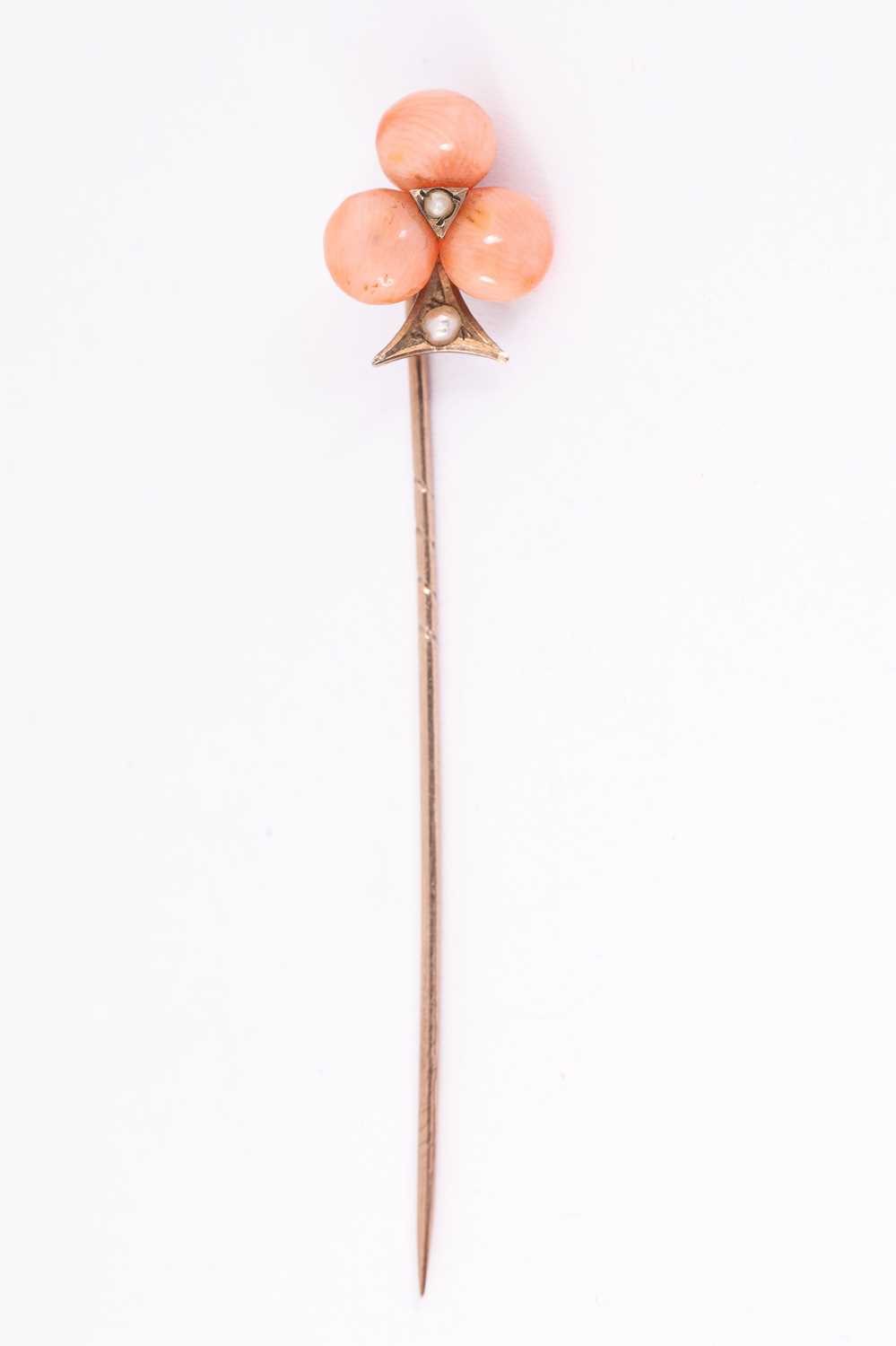 Lot 63 - A Victorian coral and pearl stick pin
