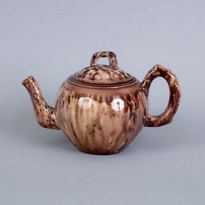 Lot 777 - A Staffordshire creamware Whieldon-type globular teapot and cover