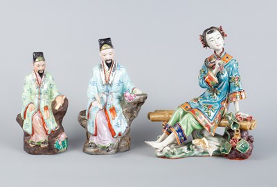 Lot 574 - Three porcelain seated figures