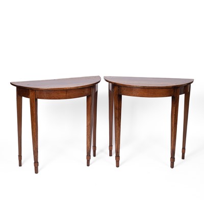 Lot 401 - A pair of walnut half-round console tables