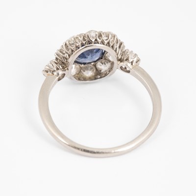 Lot 230 - An early 20th Century sapphire and diamond oval cluster ring