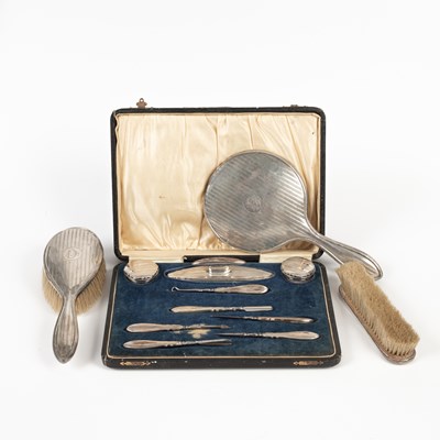 Lot 63 - A silver mounted manicure set