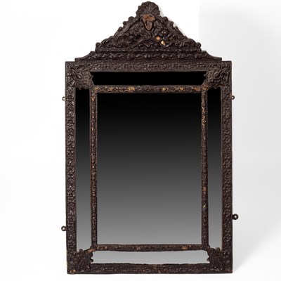 Lot 420 - A Continental repousse brass wall mirror