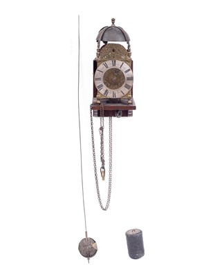 Lot 658 - A brass lantern clock