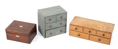 Lot 410 - A small bank of pine drawers