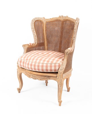 Lot 417 - A French bergère wing armchair