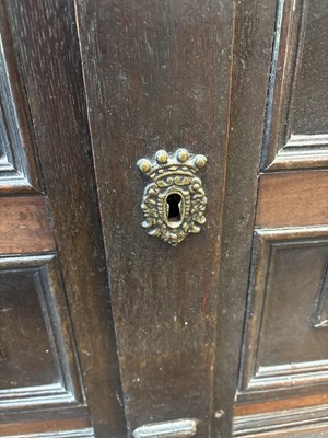 Lot 654 - A Commonwealth oak, ebonised and inlaid enclosed chest of drawers