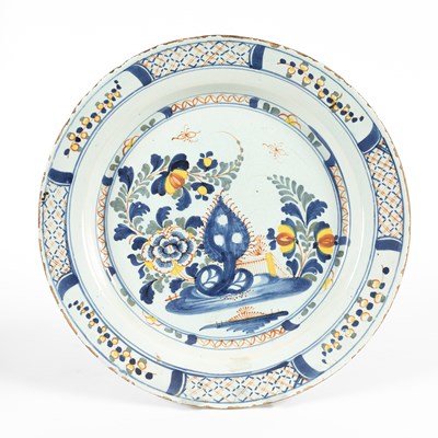 Lot 721 - An English Delftware polychrome charger