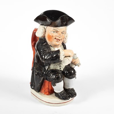 Lot 727 - An Enoch Wood type Drunken Parson (or Dr. Johnson) Toby jug