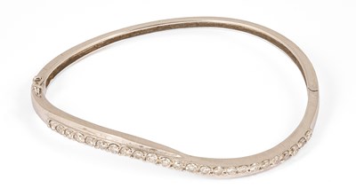 Lot 232 - An 18ct white gold and diamond bangle