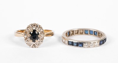 Lot 19 - A sapphire and diamond eternity ring