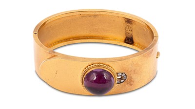 Lot 12 - A Victorian amethyst and diamond set hinged bangle