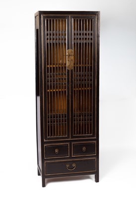 Lot 383 - A Chinese black lacquer and gilded cabinet
