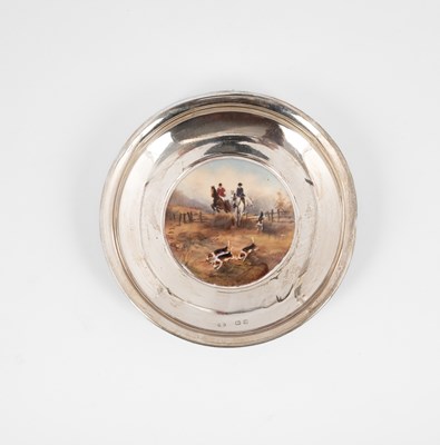 Lot 25 - A circular silver dish with enamelled hunting scene to centre