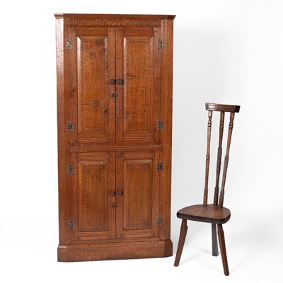 Lot 379 - An oak floor-standing corner cupboard