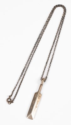 Lot 505 - A silver cricket bat pendant
