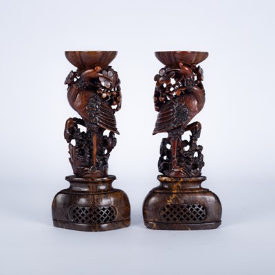 Lot 579 - A pair of Chinese carved soapstone candlesticks