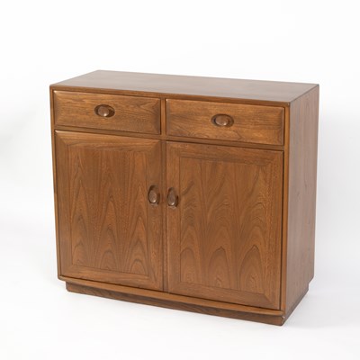 Lot 369 - An Ercol Windsor elm side cabinet