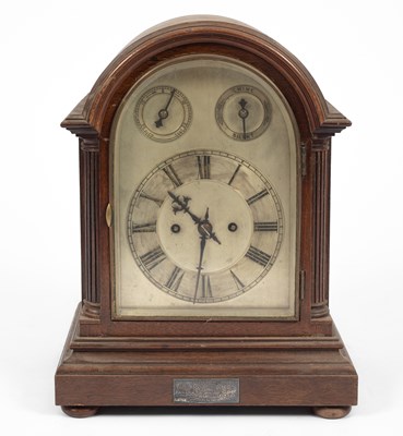 Lot 910 - An Edwardian oak cased Westminster chime mantel clock