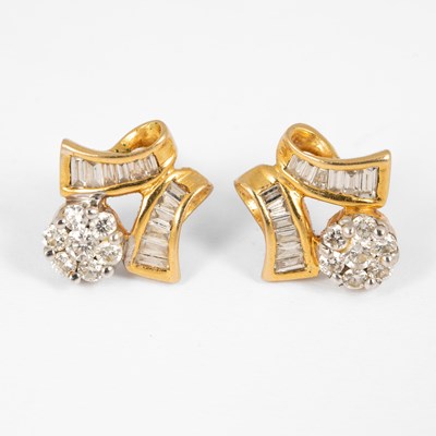 Lot 186 - A pair of yellow metal and diamond cluster earrings