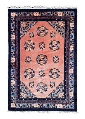 Lot 630 - A small Chinese carpet