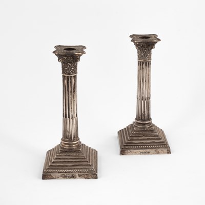 Lot 57 - A pair of silver candlesticks