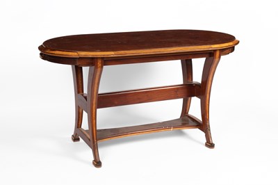 Lot 812 - A modern oval centre table in mahogany and ash