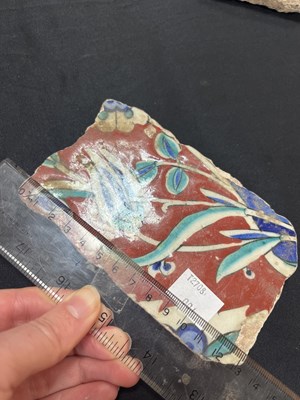 Lot 571 - A quantity of broken Iznik tiles